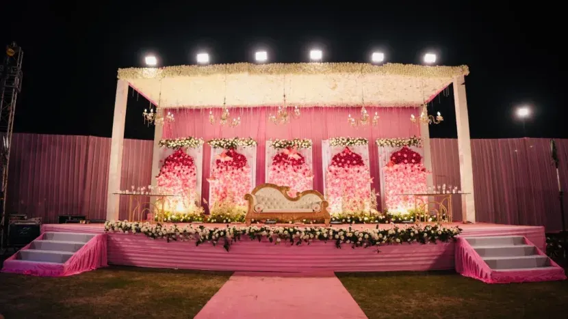 Draped stage with floral canopy at Golden Blossom, Lucknow