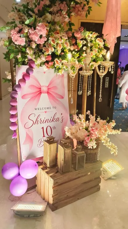 Floral welcome board on wooden crates with lanterns at a 10th birthday party in Lucknow