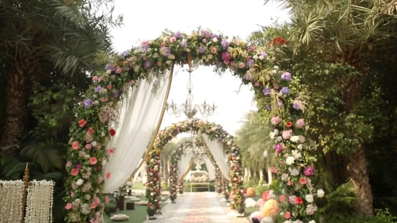 Floral wedding archway with crystal chandelier by Insight Eventz